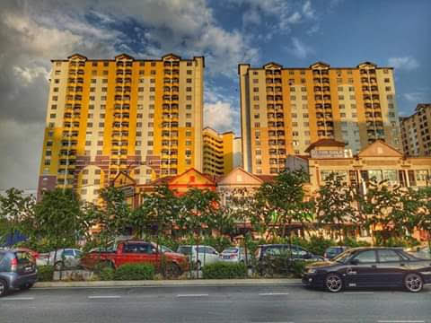 Lagoon Perdana: Exterior view of Lagoon Perdana residential towers with parked cars and landscaping in the foreground.