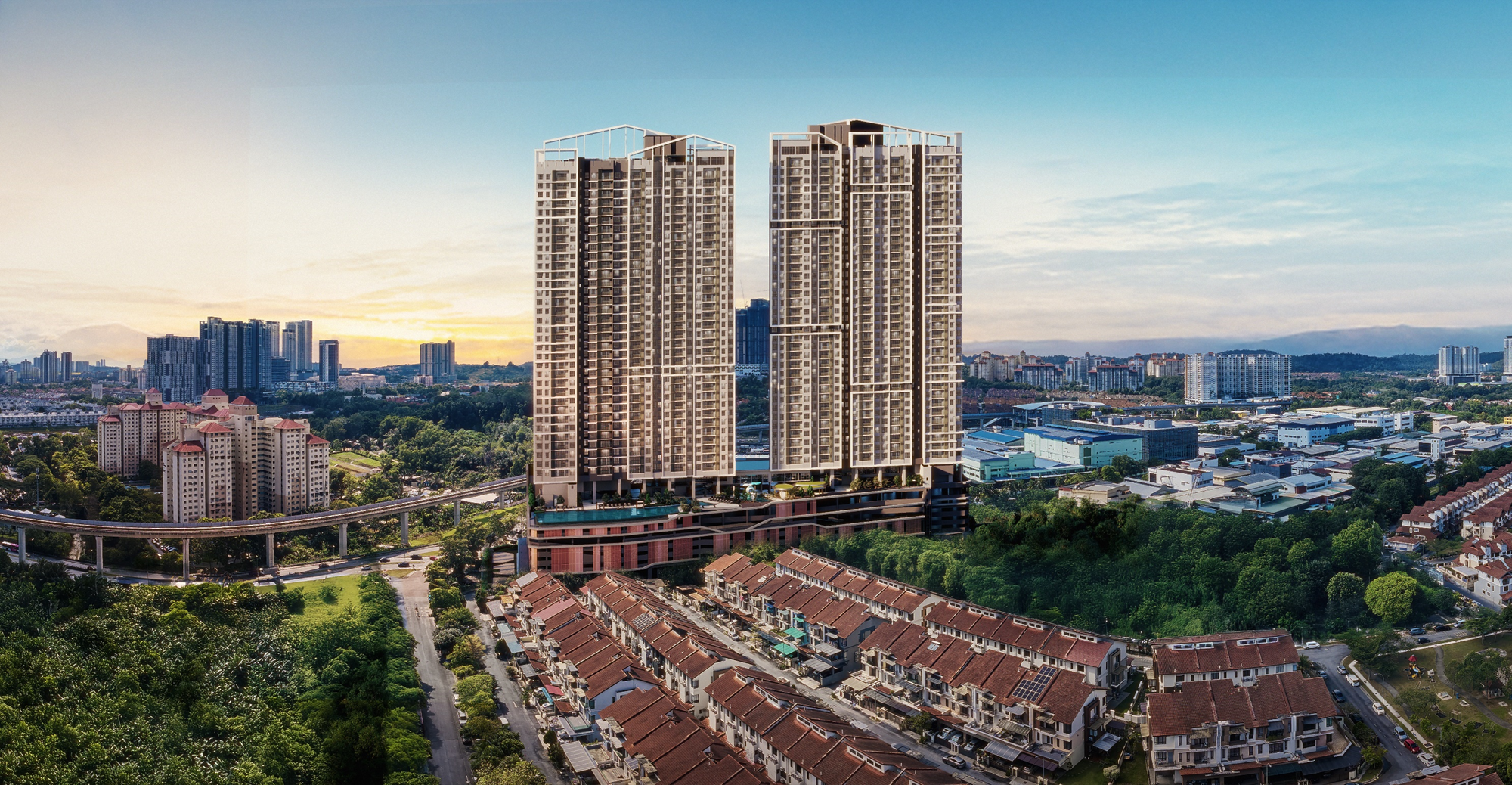 Sunway Flora 2: An aerial view of two modern residential towers rising above a low-rise neighborhood and surrounding greenery.