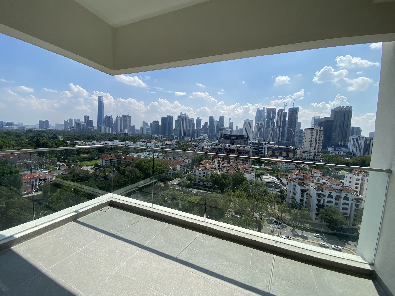 Residensi R8, Ampang Hilir: A view from a high-floor balcony looking out over a residential area and the Kuala Lumpur city skyline.
