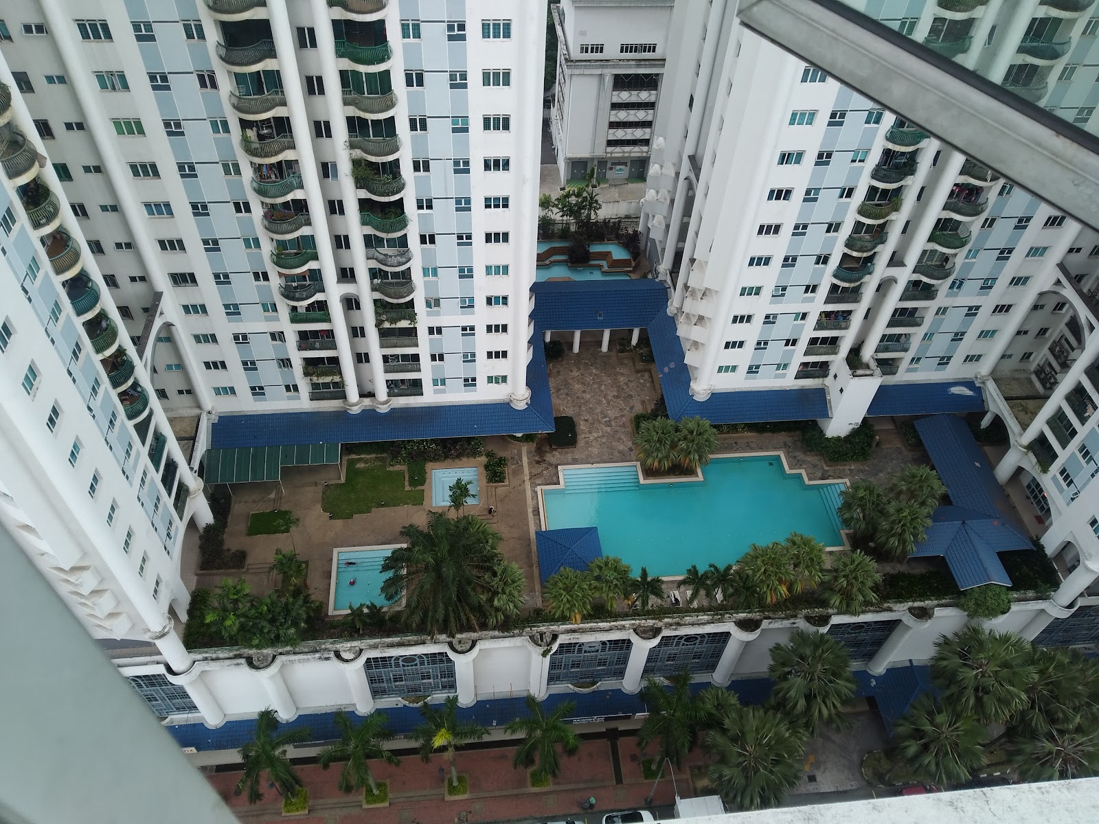 633 Residency: An aerial view of the residential development's pool complex and landscaped courtyard situated between multiple high-rise apartment towers.