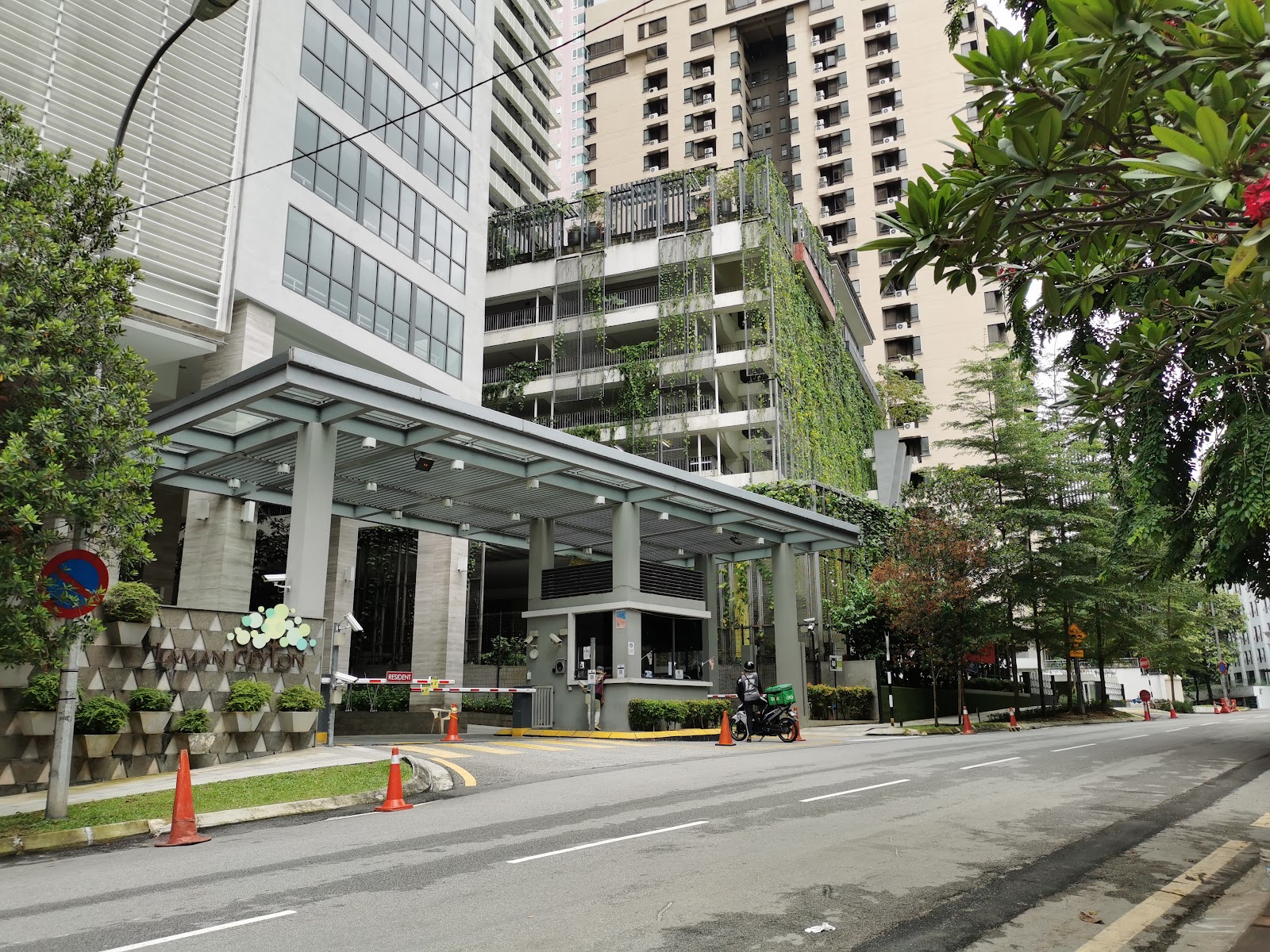 Laman Ceylon, KL: Entrance driveway and carport structure of a residential development with vertical gardens on the facade