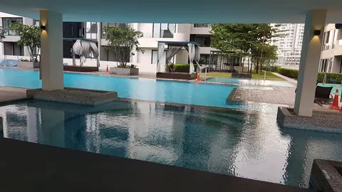 Concerto North Kiara: An outdoor swimming pool with cabanas and lounge chairs, surrounded by landscaped grounds and residential buildings.