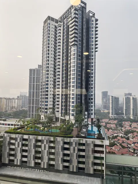SUNWAY GEO RESIDENCES: A view of a high-rise residential tower with a rooftop pool and garden area.