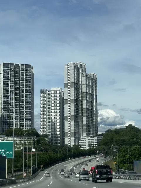 Sofiya Residensi: A view of high-rise residential towers from a highway, showing their exterior facades against the sky.
