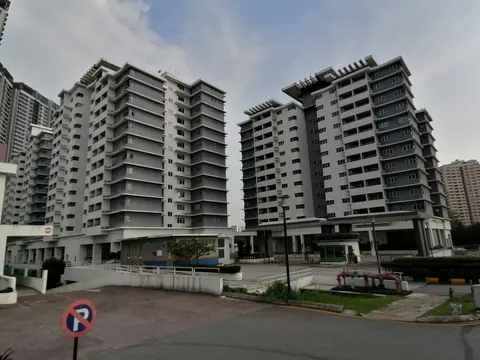 Kiara Residence 1: Two grey and white residential tower blocks with an entrance drive and parking area in the foreground.