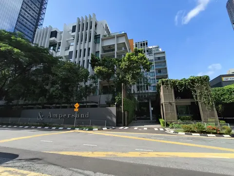 Ampersand: The exterior facade and entrance of the Ampersand condominium, with the project name on a wall.
