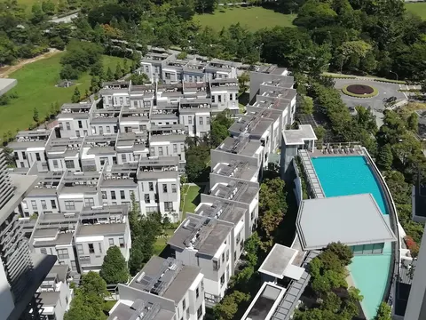 The BreezeWay Garden: An aerial view of a residential development with white multi-story buildings, trees, and a swimming pool.
