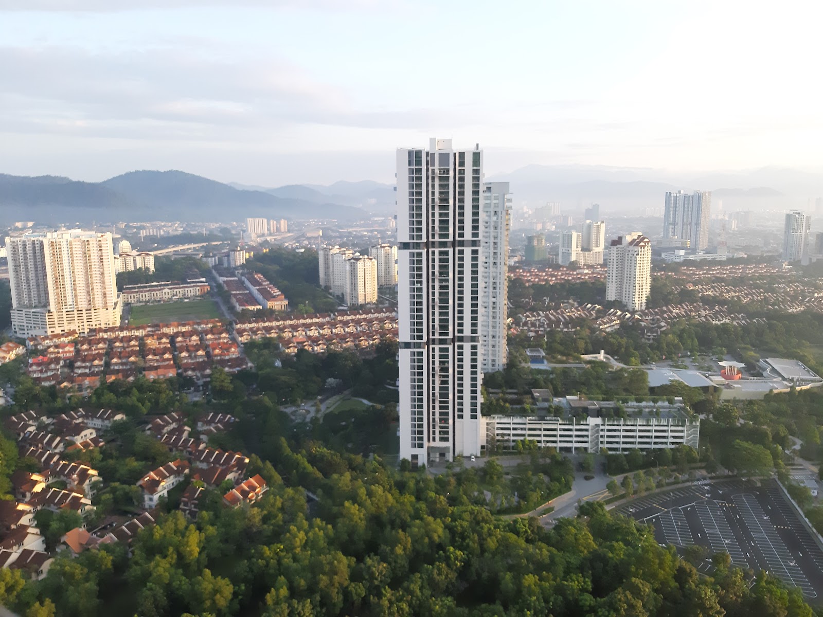 One Central Park @ Desa ParkCity: An aerial photograph looking down at the One Central Park tower and its surrounding residential neighborhoods in Desa ParkCity.